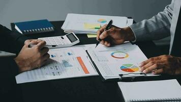 Team of business people working together in the meeting room office, teamwork background charts and graphs banner, double exposure successful teamwork,business planning concept. video