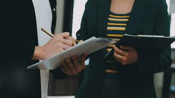 Team of business people working together in the meeting room office, teamwork background charts and graphs banner, double exposure successful teamwork,business planning concept. video