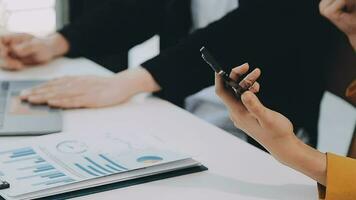 Team of business people working together in the meeting room office, teamwork background charts and graphs banner, double exposure successful teamwork,business planning concept. video