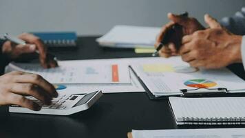 Team of business people working together in the meeting room office, teamwork background charts and graphs banner, double exposure successful teamwork,business planning concept. video