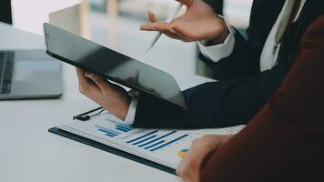 Team of business people working together in the meeting room office, teamwork background charts and graphs banner, double exposure successful teamwork,business planning concept. video