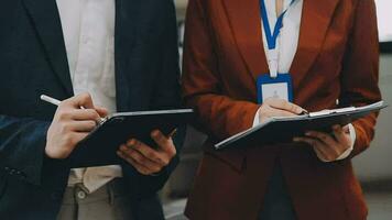 Team of business people working together in the meeting room office, teamwork background charts and graphs banner, double exposure successful teamwork,business planning concept. video