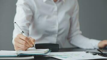 Financial Businesswomen analyze the graph of the company's performance to create profits and growth, Market research reports and income statistics, Financial and Accounting concept. video