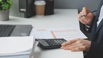 Financial Businesswomen analyze the graph of the company's performance to create profits and growth, Market research reports and income statistics, Financial and Accounting concept. video