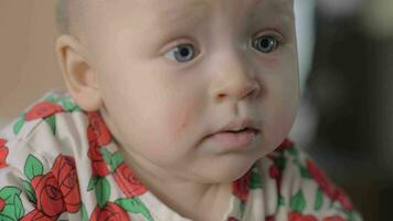 Quiet blue-eyed baby girl standing in crib video