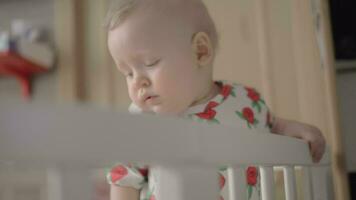 Baby getting fussy standing in the crib video