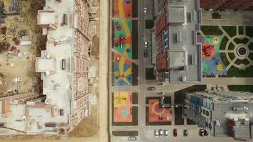 Flying over new-built house and apartment block under construction, Russia video