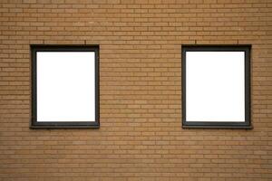 Two blank windows with wooden frames on orange brick wall background photo