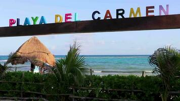 Colorful Playa del Carmen lettering sign symbol on beach Mexico. video