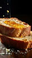 A slice of bread with butter and honey dripping down the side photo