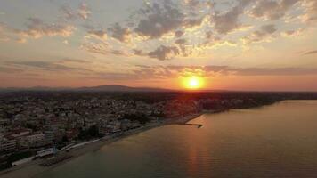 Aerial scene of coastal town at sunrise Nea Kallikratia, Greece video