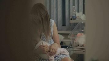 Mother breastfeeding newborn in maternity hospital video