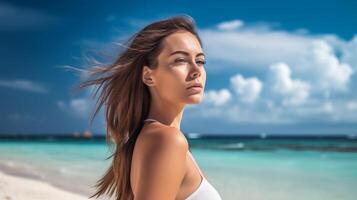 Portrait of an Attractive Young Woman on Tropical Beach photo