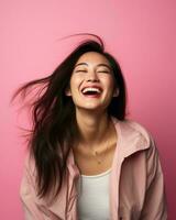 portrait of happy young asian woman laughing isolated on pink background stock photo generative AI