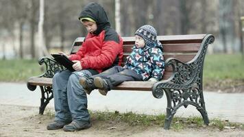 Two brothers with tablet computer video