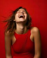 a woman laughing in a red dress against a red background generative ai photo