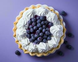 blueberry pie with whipped cream and fresh blueberries on a purple background top view generative ai photo