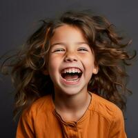 portrait of a happy little girl laughing on a dark background stock photo generative ai
