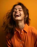 portrait of smiling young woman laughing on orange background stock photo generative ai