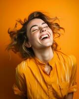 portrait of smiling young woman laughing on orange background stock photo generative ai