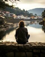 a person sitting on a stone wall generative ai photo