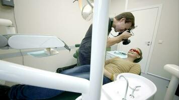 Dentist making photo of patients smile video