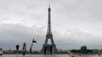 City visitors at viewing point taking shots with Eiffel Tower, Paris video