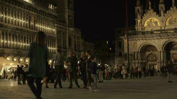 Crowded St Marks Square in night Venice, Italy video