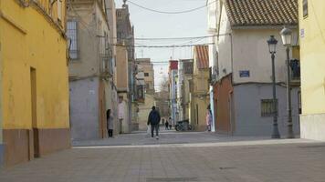 Houses and some people in Barraca street in Valencia, Spain video