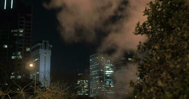 Tel Aviv night cityscape with condensing steam video