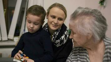 Woman with son visiting senior grandmother video