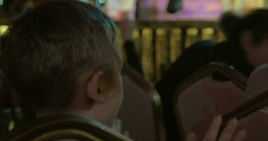 Boy watching theatrical performance and applauding video