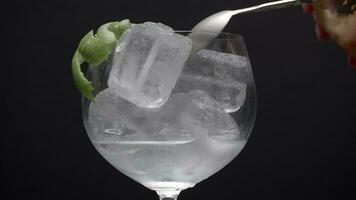 Lime peel, ice cube, some fizz video