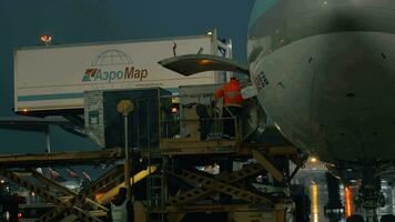 Loading cargo onto the plane with container loader video