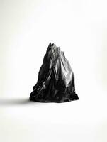 arafed black plastic bag on white background with mountain in background. generative ai. photo