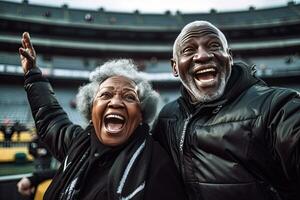 Happy Senior couple black etired ,Cheer on your favorite foottball team, football fans, at the football stadium. created with generative ai. photo