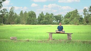 Asian girl meditation or stand yoga at outdoor, countryside of Thailand. photo