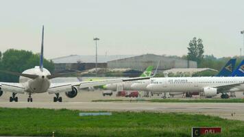 ALMATY, KAZAKHSTAN MAY 4, 2019 - Air Astana Boeing 757 taxis after landing on the airfield to the terminal. Airport of Almaty, Kazakhstan ALA video