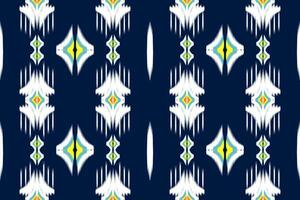 Seamless pattern of Ikat Paisley, traditional seamless pattern, dark blue background, Aztec style, embroidery, abstract, vector, design illustration for texture, fabric, print. vector