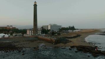 Aerial shot of the coast with resort and lighthouse video