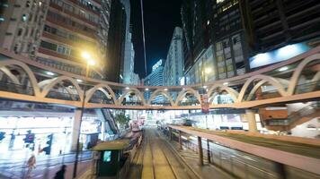 Timelapse of traveling through night Hong Kong by double-decker tram video