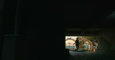 Young girl in headphones jumping rope in city Perea, Greece video