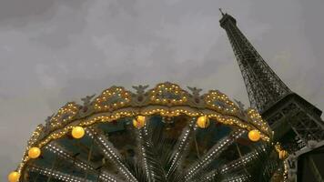 Vintage carousel and Eiffel Tower in the evening video