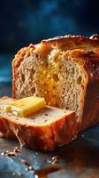 A slice of bread with butter and honey dripping down the side photo