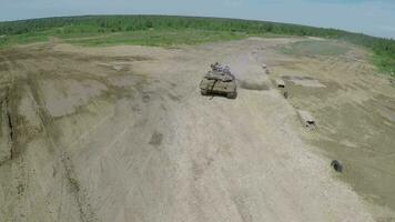 Tank on the finish during maneuvers, aerial shot video