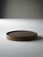 Empty round podium for product display. Chocolate color podium with gray background photo