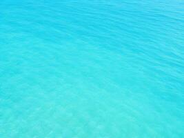 Top view of shiny wave of clear blue sea water, Blue background photo