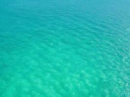 Beautiful tropical turquoise clear sea water surface photo