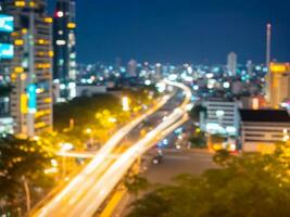 bstract blurred night light of city bokeh, City motorway rush hour traffic photo