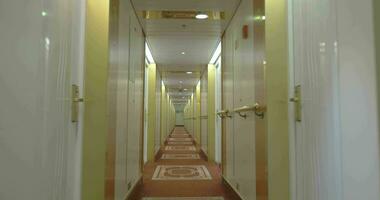 Moving in hotel corridor with light interior video